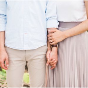 Close up of couple holding hands during their engagement session at Jack Darling Park